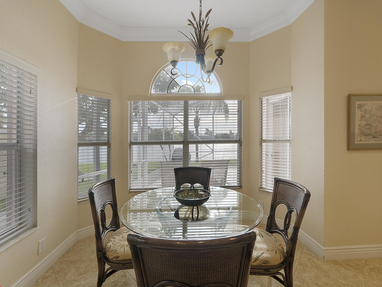8354 Horseshoe Bay Road Boynton Beach, FL 33472 - Photo 6 of 13 a view of a dining room with furniture wooden floor and chandelier