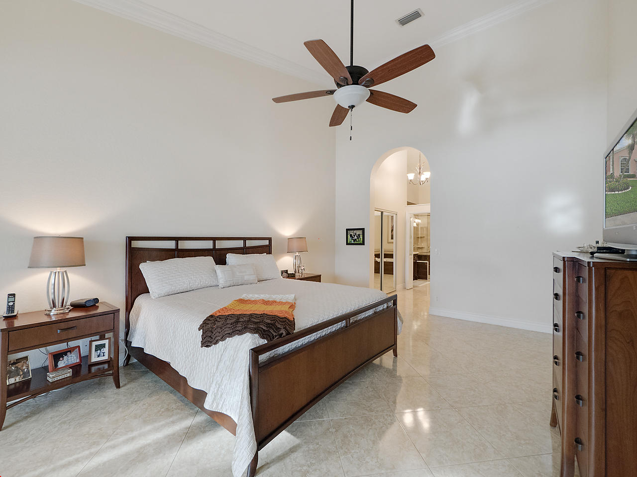 8354 Horseshoe Bay Road Boynton Beach, FL 33472 - Photo 7 of 13 a bed room with a bed and a chandelier