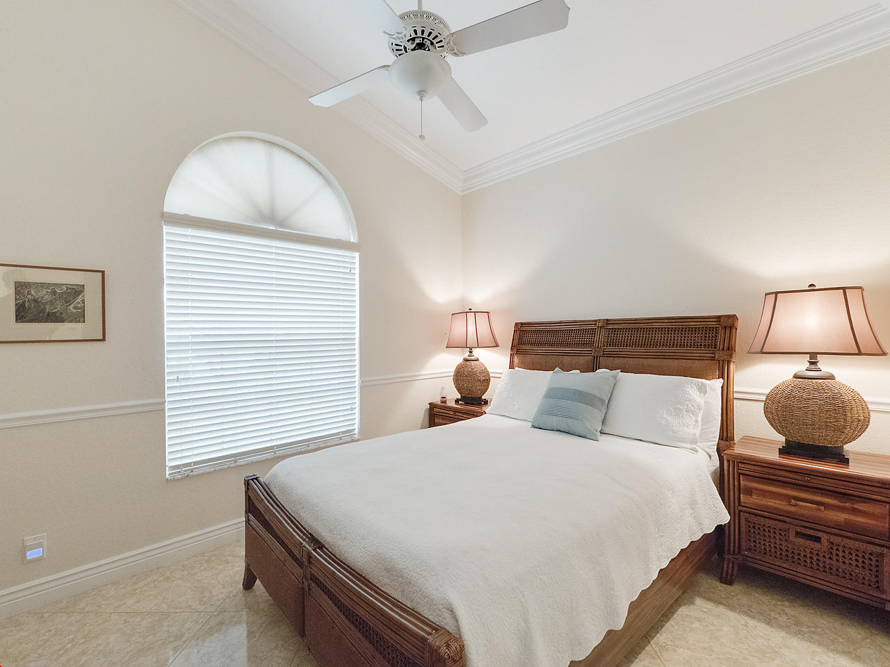 8354 Horseshoe Bay Road Boynton Beach, FL 33472 - Photo 9 of 13 a bedroom with a bed and a chandelier