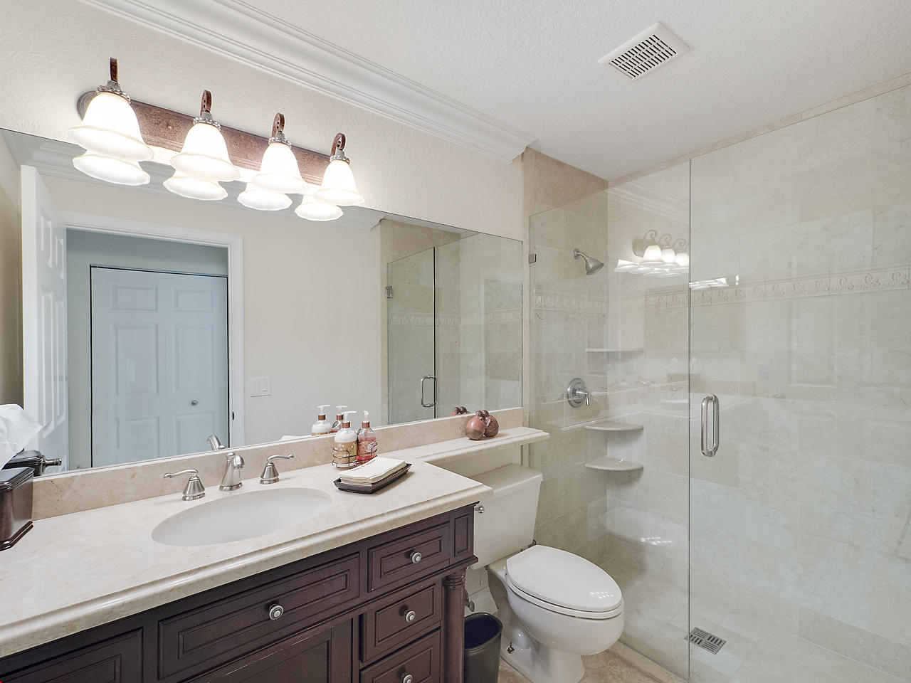 8354 Horseshoe Bay Road Boynton Beach, FL 33472 - Photo 10 of 13 a bathroom with a double vanity sink mirror and toilet