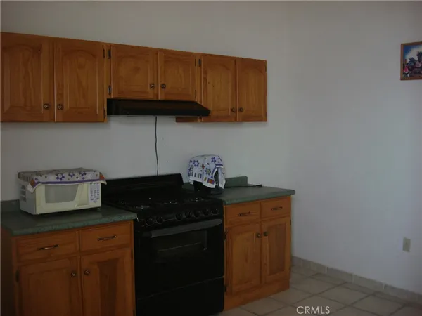 a kitchen with granite countertop cabinets and sink