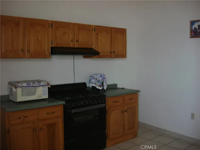 a kitchen with granite countertop cabinets and sink