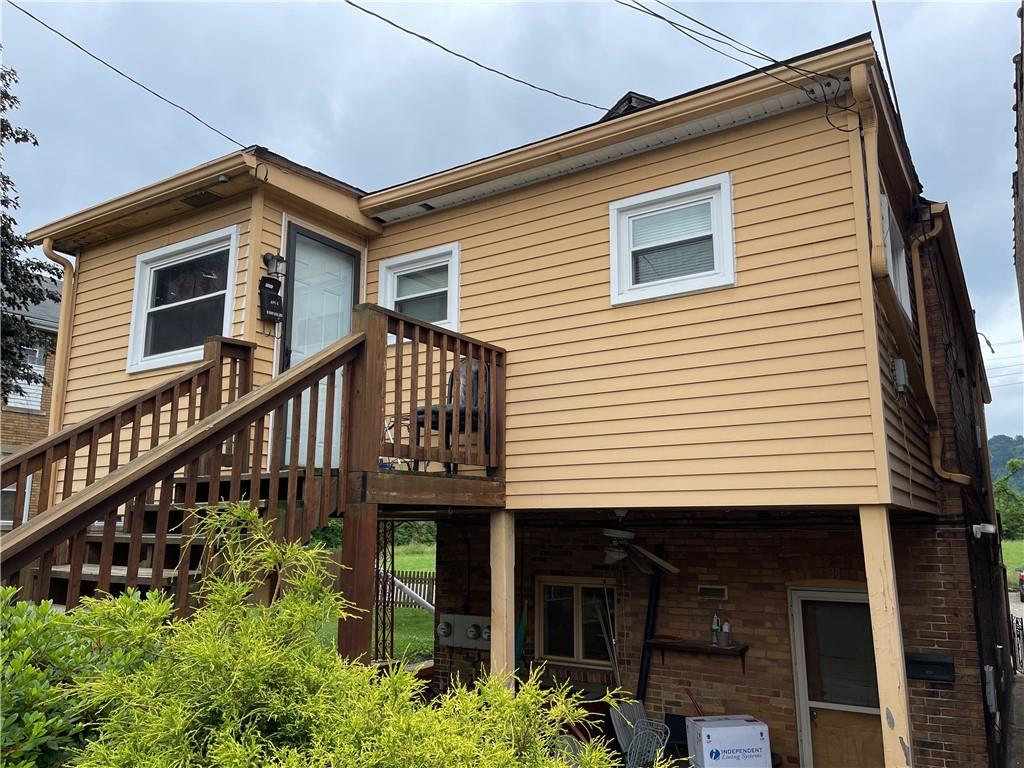 338 Park Ambridge, PA 15003 - Photo 7 of 12 a front view of a house with yard and deck