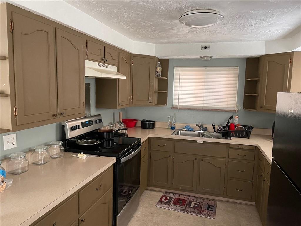 338 Park Ambridge, PA 15003 - Photo 9 of 12 a kitchen with a sink cabinets and window
