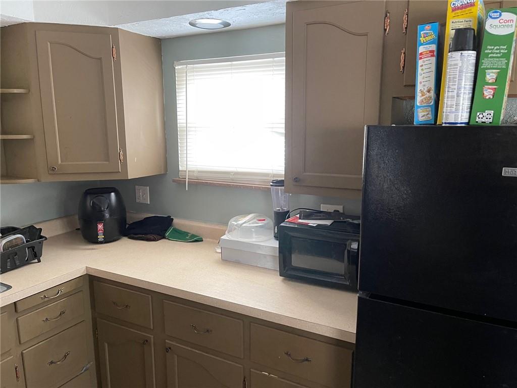 338 Park Ambridge, PA 15003 - Photo 10 of 12 a kitchen with a sink and cabinets