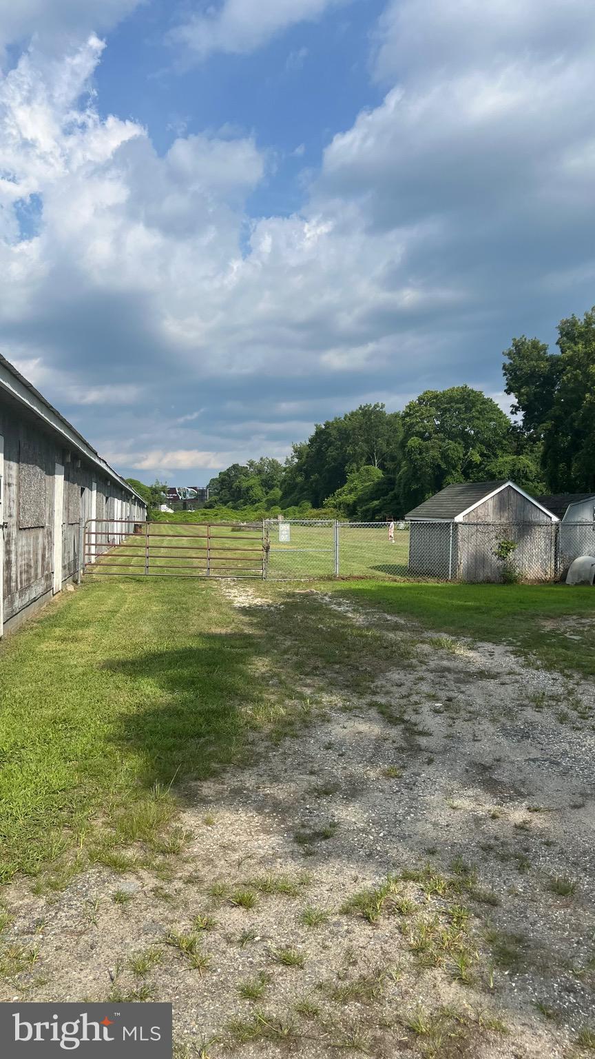 11229 Stewart Neck Road Princess Anne, MD 21853 - Photo 4 of 9 a view of a lake with a big yard