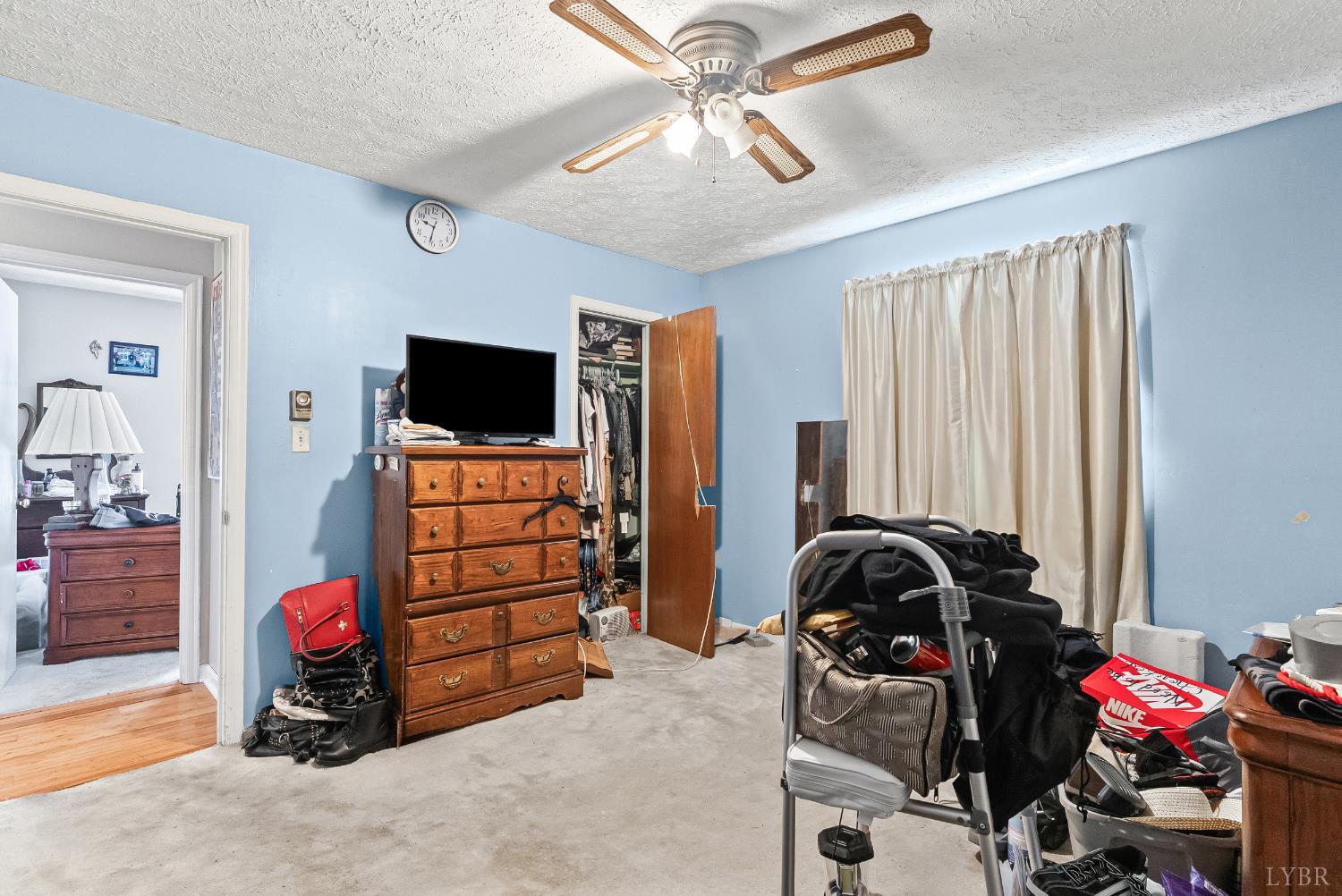 473 Forest Sale Road Amherst, VA 24521 - Photo 14 of 39 a bedroom with a bed and a flat tv screen