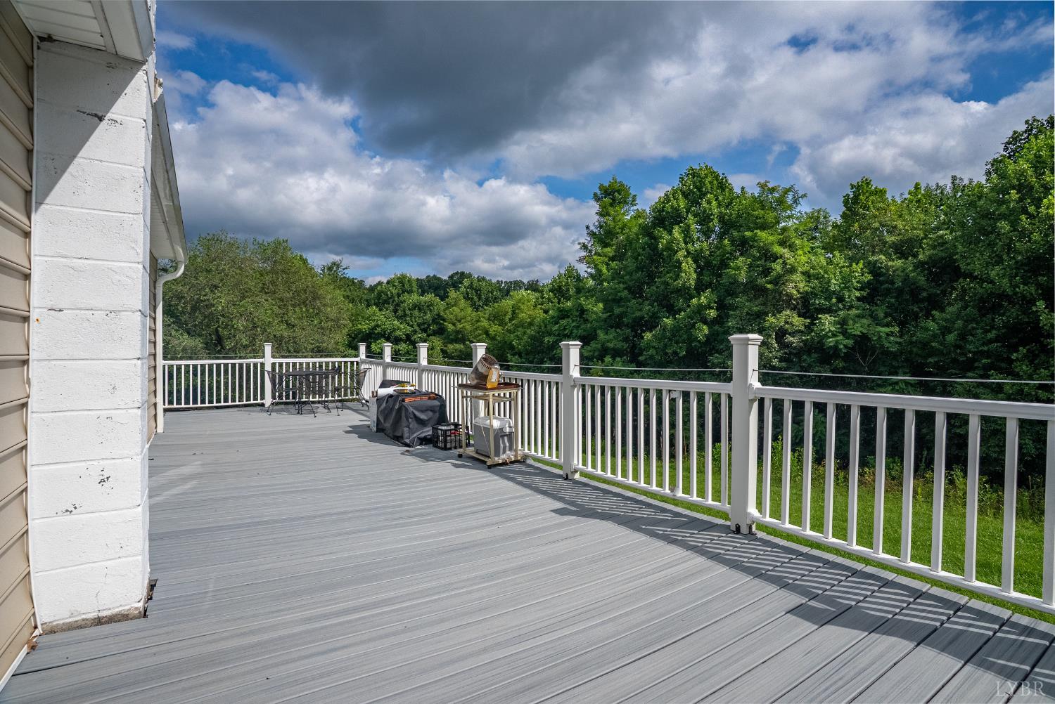 473 Forest Sale Road Amherst, VA 24521 - Photo 22 of 39 a view of a balcony with wooden floor and fence