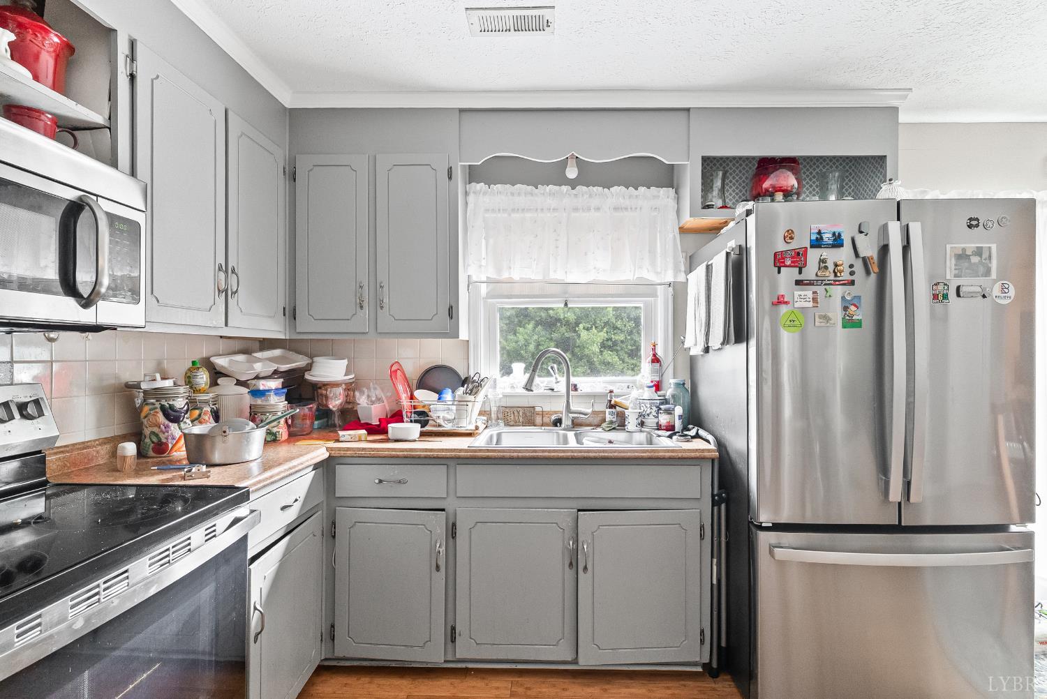 473 Forest Sale Road Amherst, VA 24521 - Photo 7 of 39 a kitchen with appliances a sink and cabinets