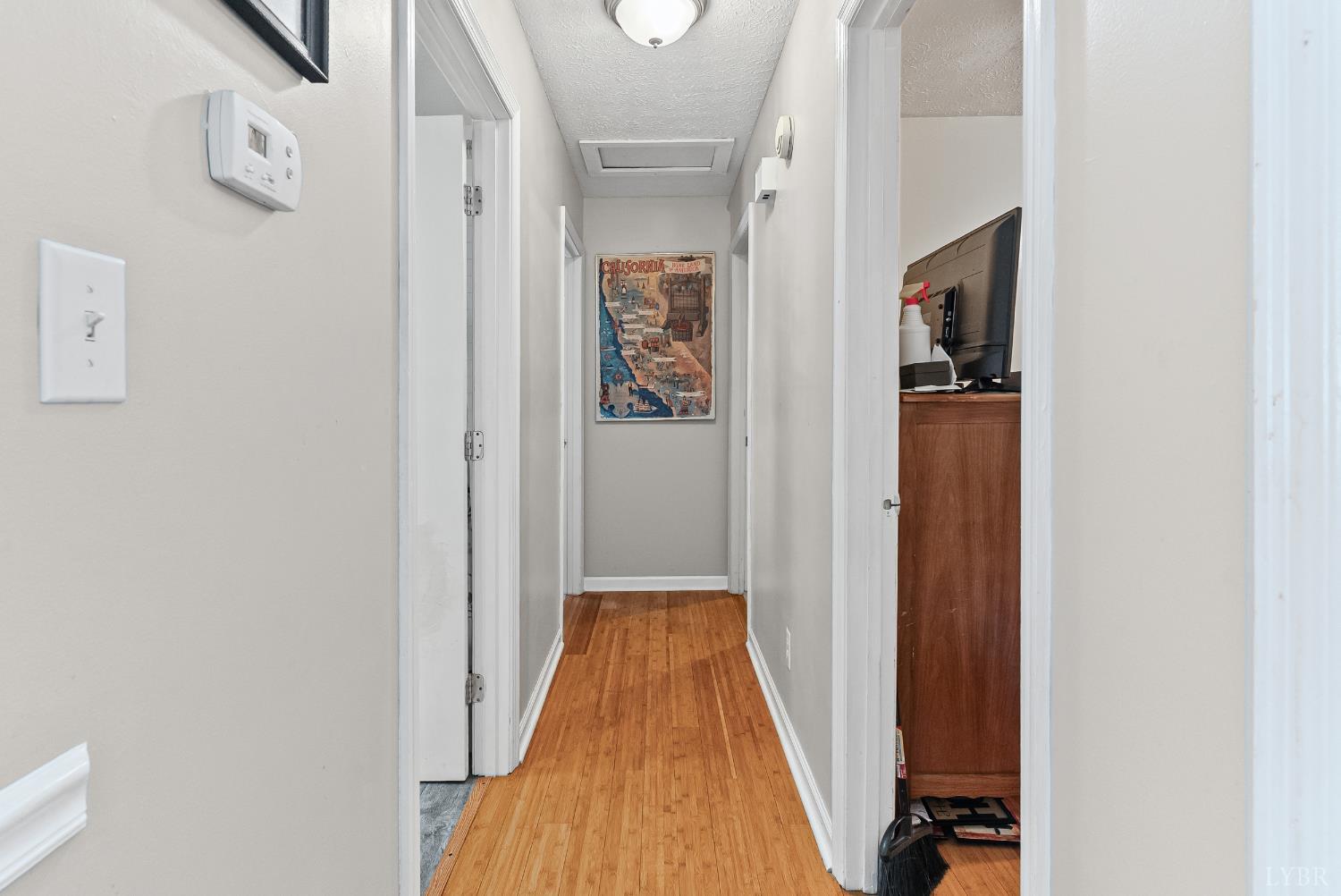 473 Forest Sale Road Amherst, VA 24521 - Photo 9 of 39 a view of a hallway with wooden floor and staircase