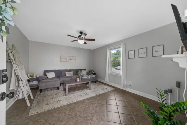 a living room with furniture and white walls