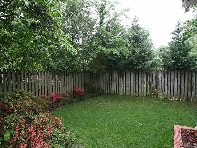 1919 Sunset Drive Raleigh, NC 27608 - Photo 11 of 12 a garden covered with wooden fence