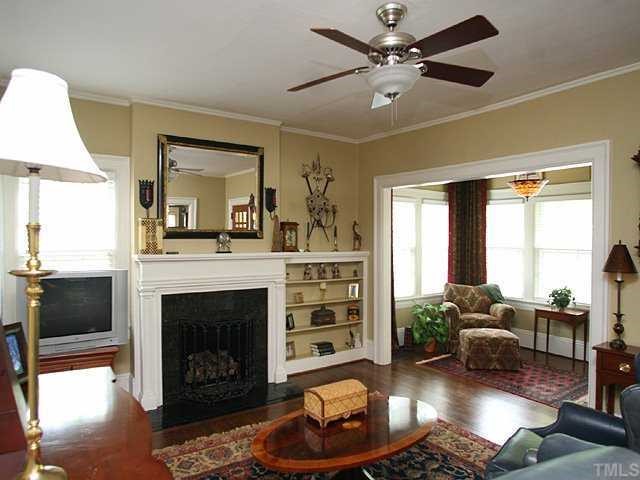 1919 Sunset Drive Raleigh, NC 27608 - Photo 6 of 12 a living room with furniture and a fireplace
