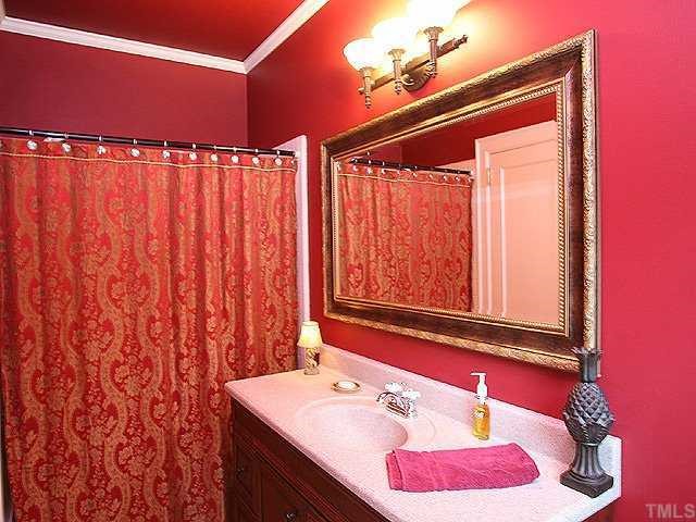 1919 Sunset Drive Raleigh, NC 27608 - Photo 8 of 12 a bathroom with a sink and a mirror