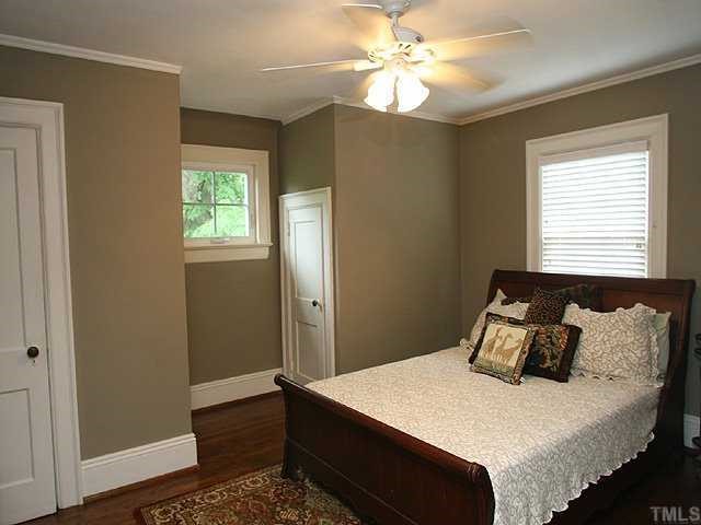 1919 Sunset Drive Raleigh, NC 27608 - Photo 9 of 12 a bedroom with a bed and a window