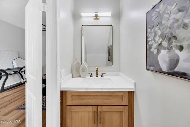 a bathroom with a sink and a mirror