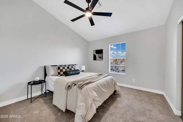 a bedroom with a bed and a book shelf