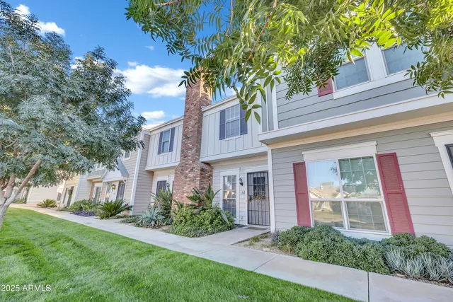 a house that has a tree in front of the house
