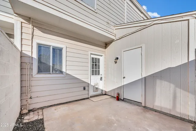 a view of front door and white house