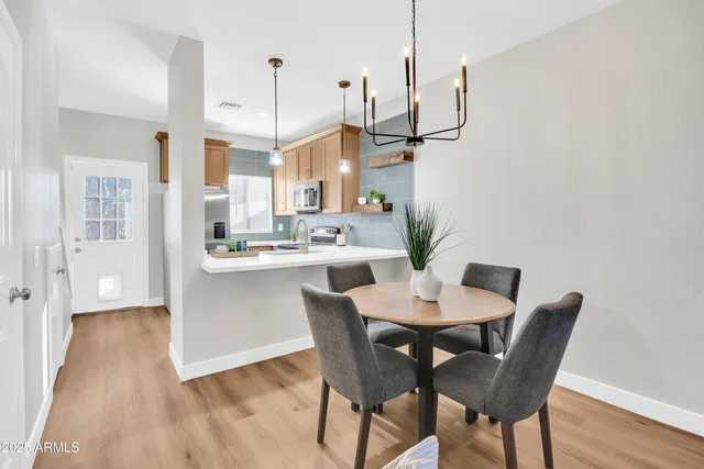 a view of a dining room with furniture window and wooden floor