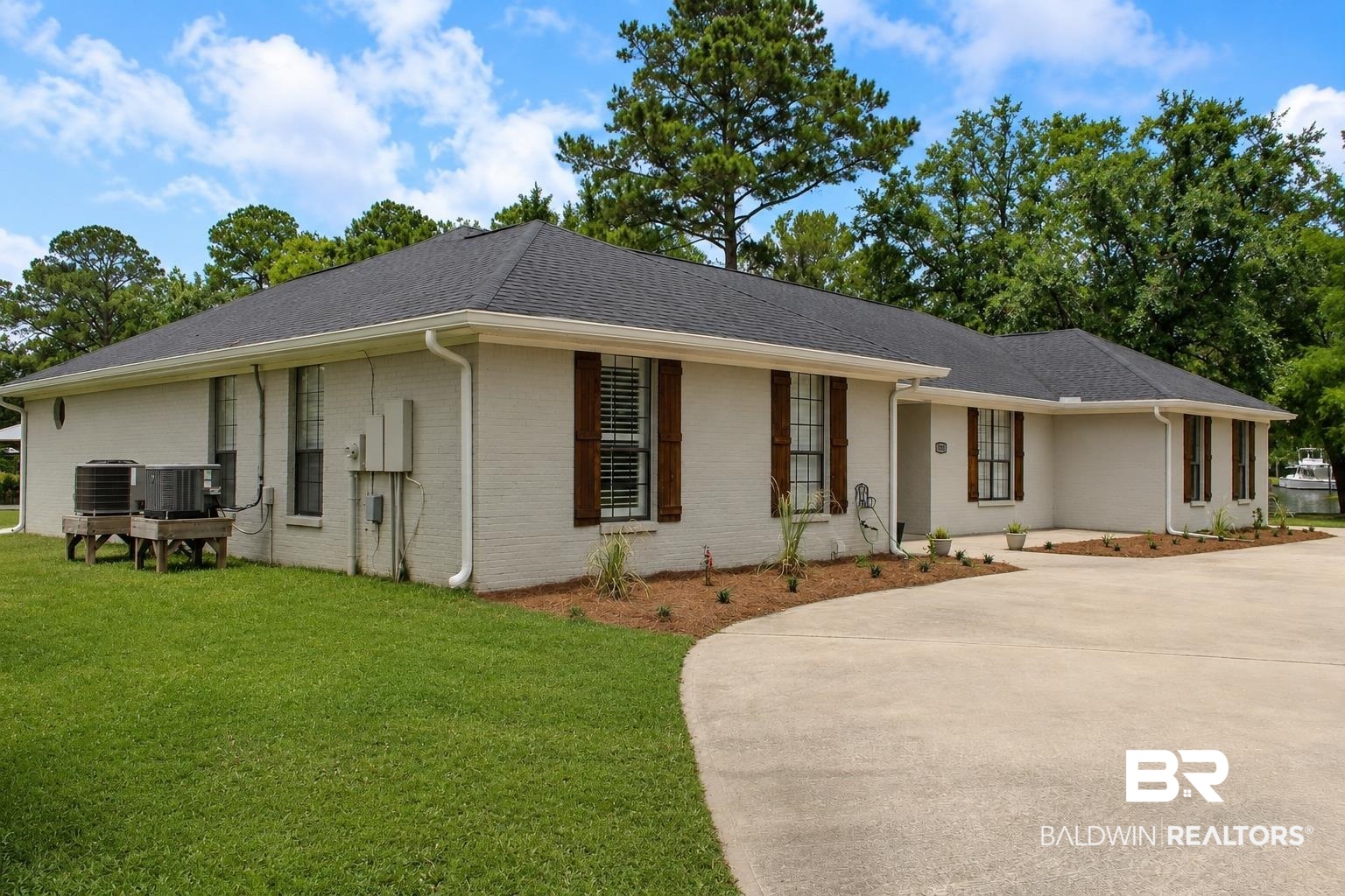 9825 Wolf Creek Ridge Elberta, AL 36530 - Photo 5 of 76 Light-toned brick exterior with dark shingle roofing