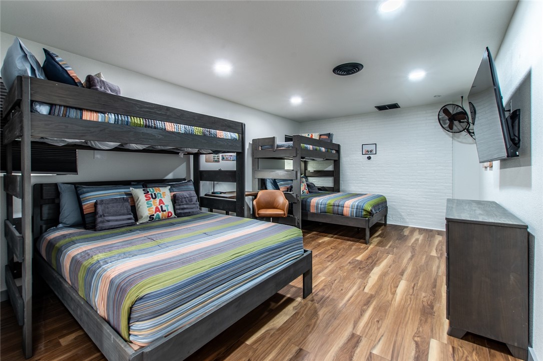 1617 Ocean Drive Corpus Christi, TX 78404 - Photo 23 of 40 a bedroom with bed and a large window