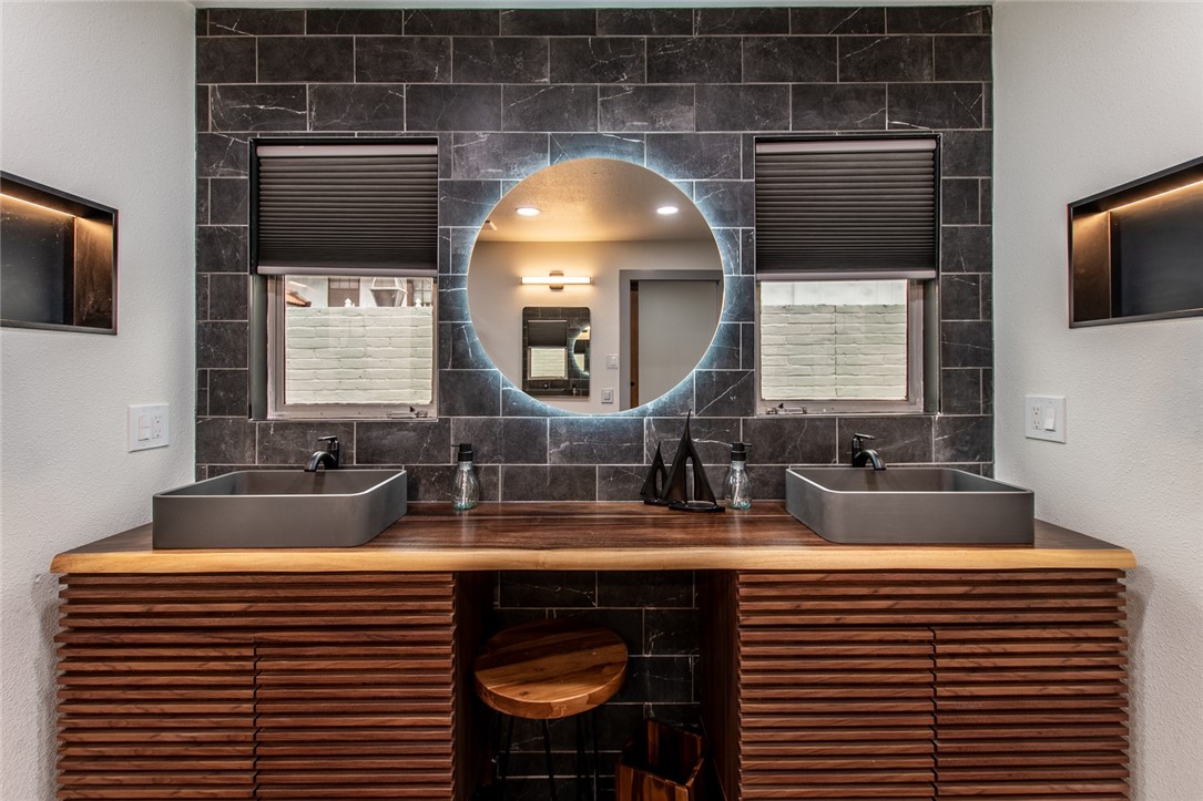 1617 Ocean Drive Corpus Christi, TX 78404 - Photo 25 of 40 a bathroom with a sink and a mirror