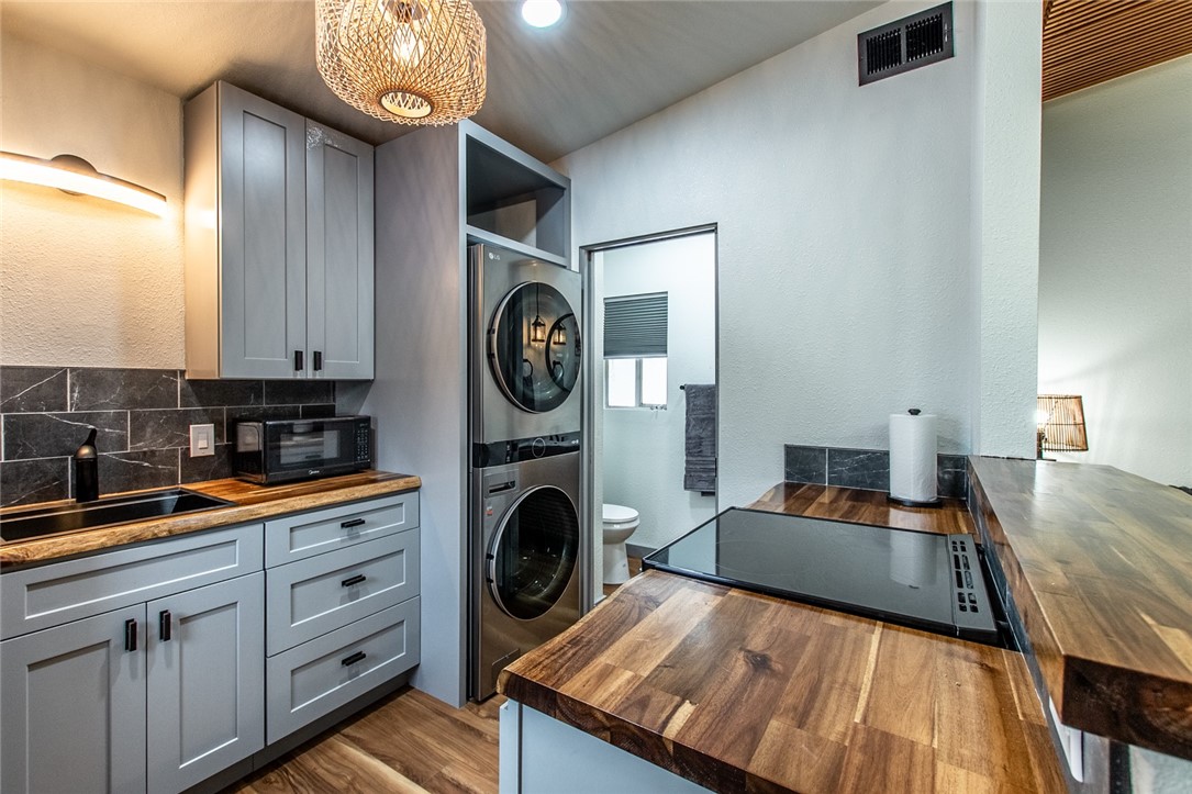 1617 Ocean Drive Corpus Christi, TX 78404 - Photo 35 of 40 a view of a kitchen with a sink a washer and dryer