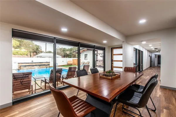 a view of a dining room with furniture window and wooden floor
