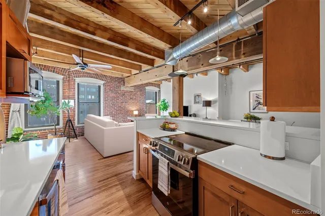 a kitchen with a stove and a refrigerator