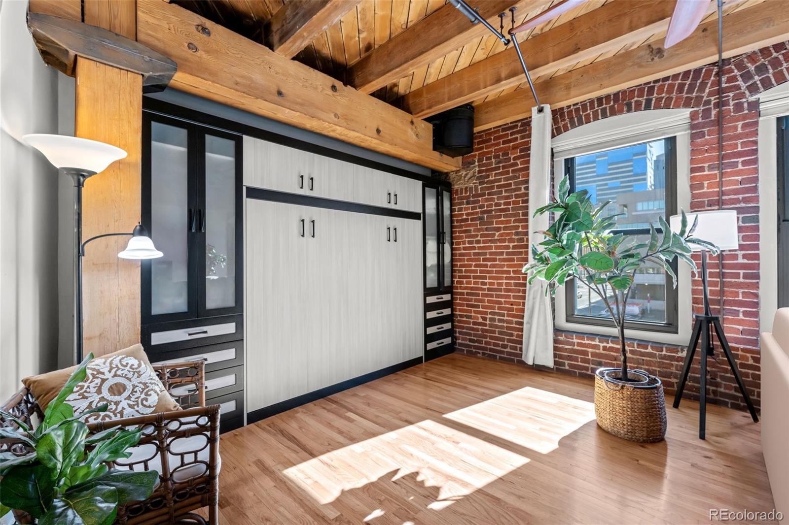 1745 Wazee Street, Unit 3C Denver, CO 80202 - Photo 18 of 23 a view of a patio with table and chairs and potted plants