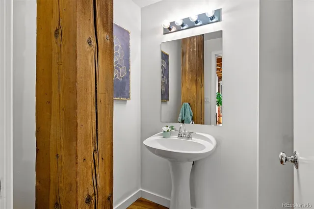 a bathroom with a sink and mirror