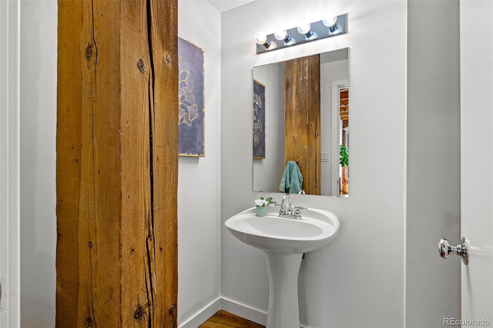 1745 Wazee Street, Unit 3C Denver, CO 80202 - Photo 19 of 23 a bathroom with a sink and mirror