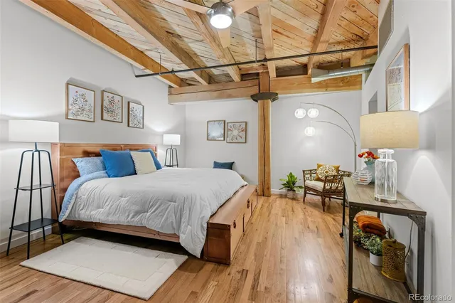 a bed room with a bed and a table