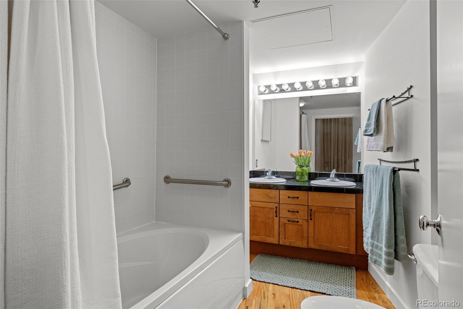 1745 Wazee Street, Unit 3C Denver, CO 80202 - Photo 23 of 23 a spacious bathroom with a tub a sink and mirror