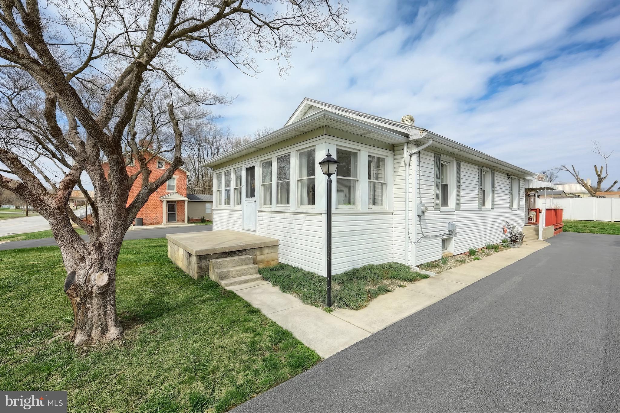 6016 Baltimore Pike Littlestown, PA 17340 - Photo 1 of 32 a front view of a house with a yard and garage