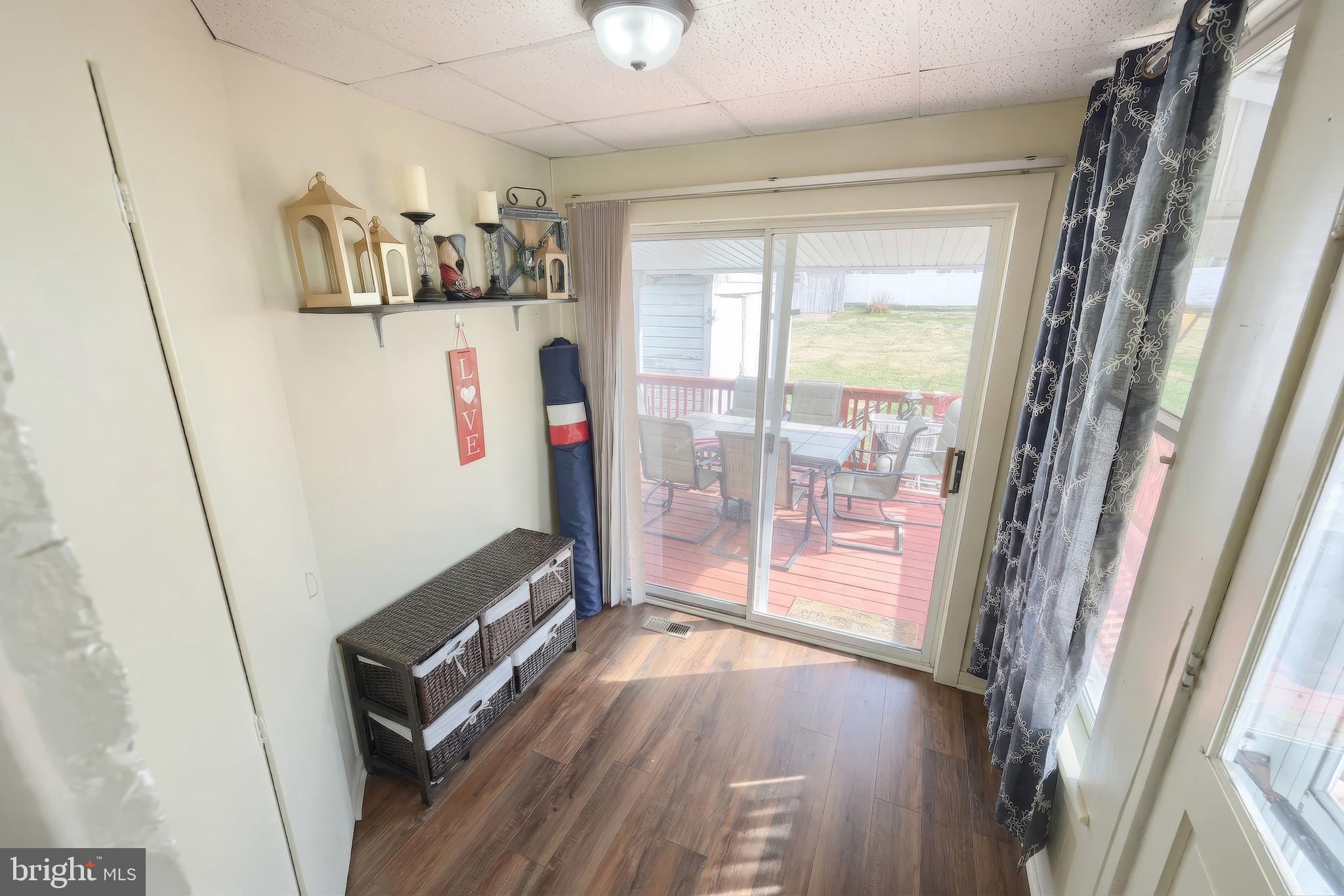 6016 Baltimore Pike Littlestown, PA 17340 - Photo 12 of 32 a view of a hallway with wooden floor and windows