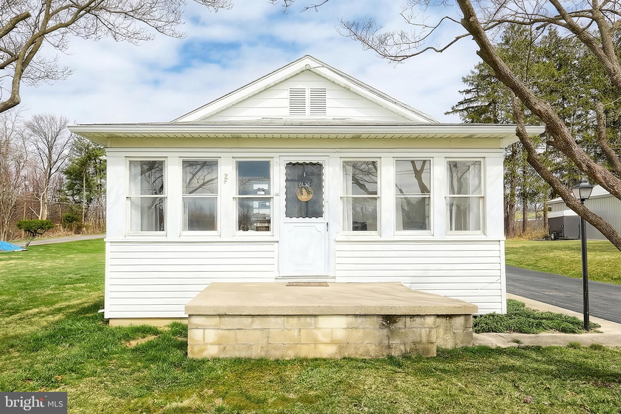 6016 Baltimore Pike Littlestown, PA 17340 - Photo 2 of 32 a front view of a house with a yard