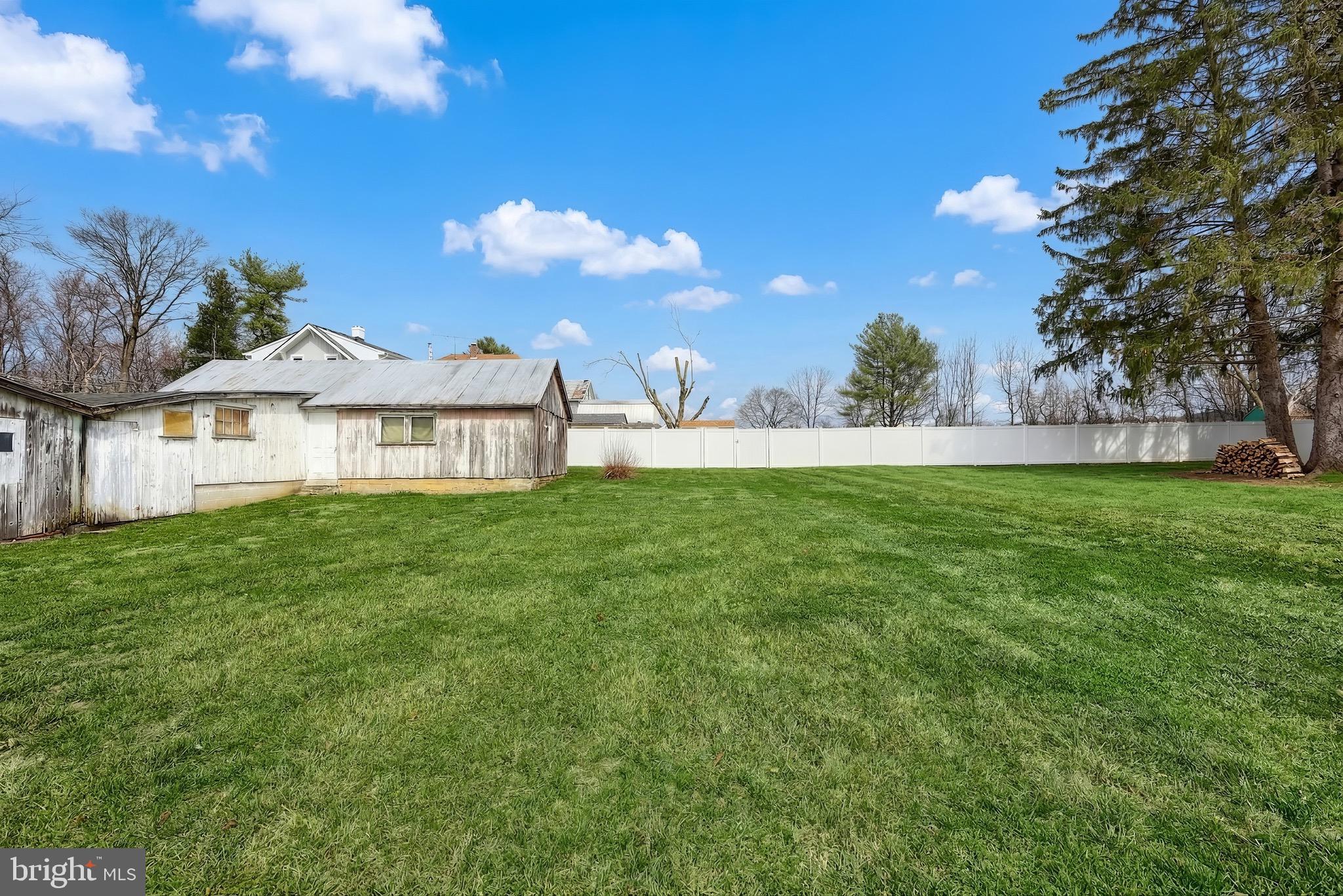 6016 Baltimore Pike Littlestown, PA 17340 - Photo 25 of 32 a front view of a house with garden
