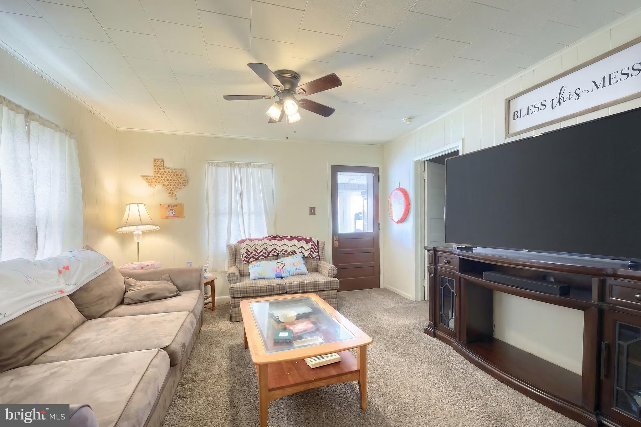 6016 Baltimore Pike Littlestown, PA 17340 - Photo 4 of 32 a living room with furniture and a flat screen tv