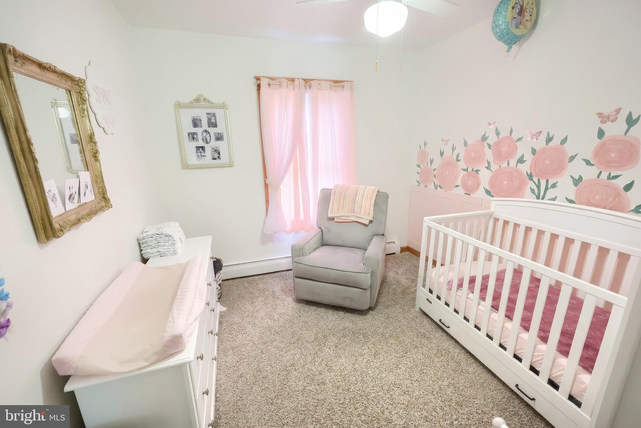 6016 Baltimore Pike Littlestown, PA 17340 - Photo 9 of 32 a bedroom with furniture and a wooden floor