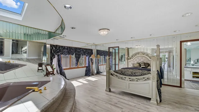 a kitchen that has a sink a stove and a wooden floor