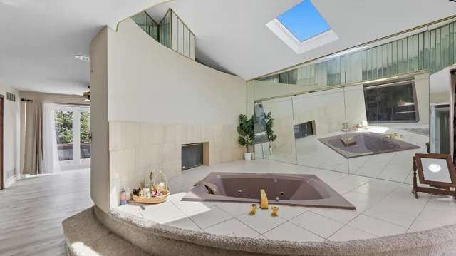 a living room with furniture and flat screen tv