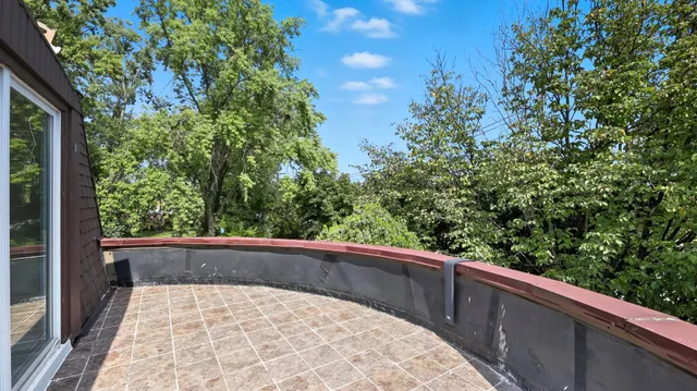 a view of a backyard with sitting area