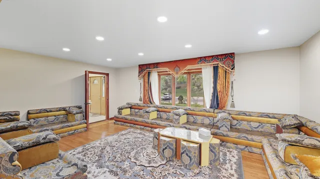 a very nice looking living room with a large window