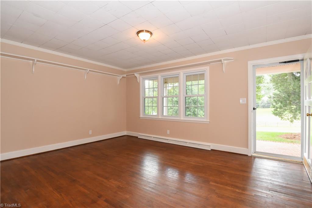 7836 Alcorn Road Oak Ridge, NC 27310 - Photo 2 of 28 Living Room - light filled room with hardwoods