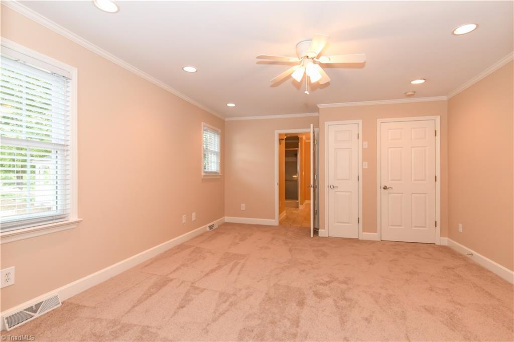 7836 Alcorn Road Oak Ridge, NC 27310 - Photo 11 of 28 Master bedroom connects to a large master bath.