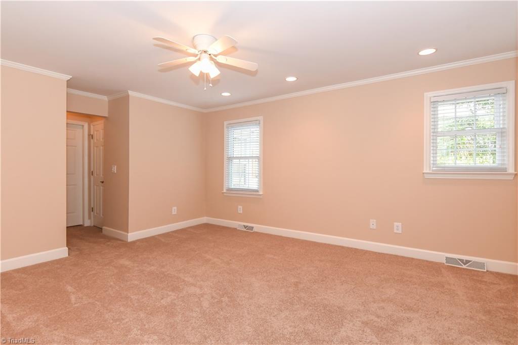 7836 Alcorn Road Oak Ridge, NC 27310 - Photo 13 of 28 Light filled, recessed lighting, ceiling fan, and new carpet.