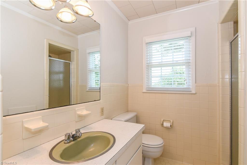 7836 Alcorn Road Oak Ridge, NC 27310 - Photo 18 of 28 Hall bath that serves bedrooms 2 and 3.