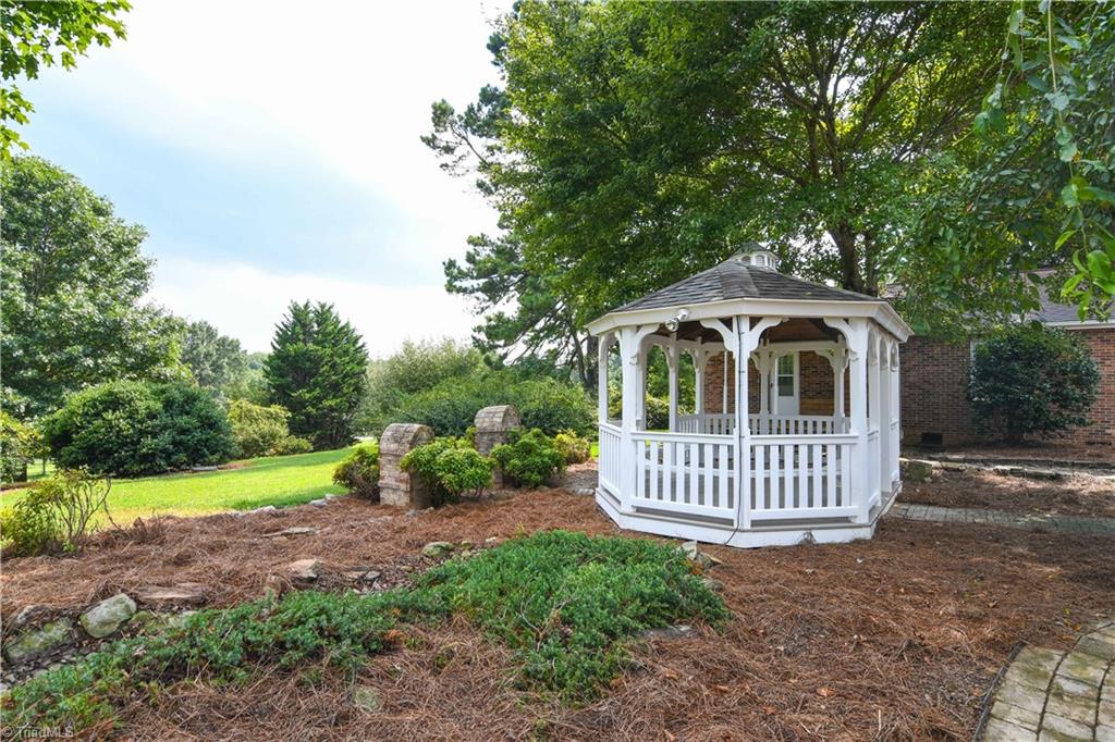 7836 Alcorn Road Oak Ridge, NC 27310 - Photo 20 of 28 This gazebo was built in 2008 and is wired.